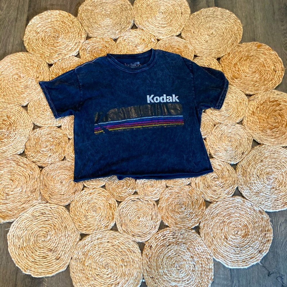 A black crop top with a Kodak graphic design
